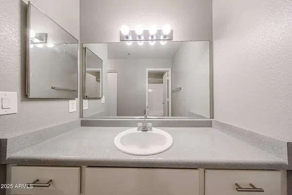 a view of room with ceiling fan and window