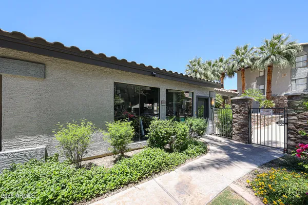 a view of a house with swimming pool and a porch