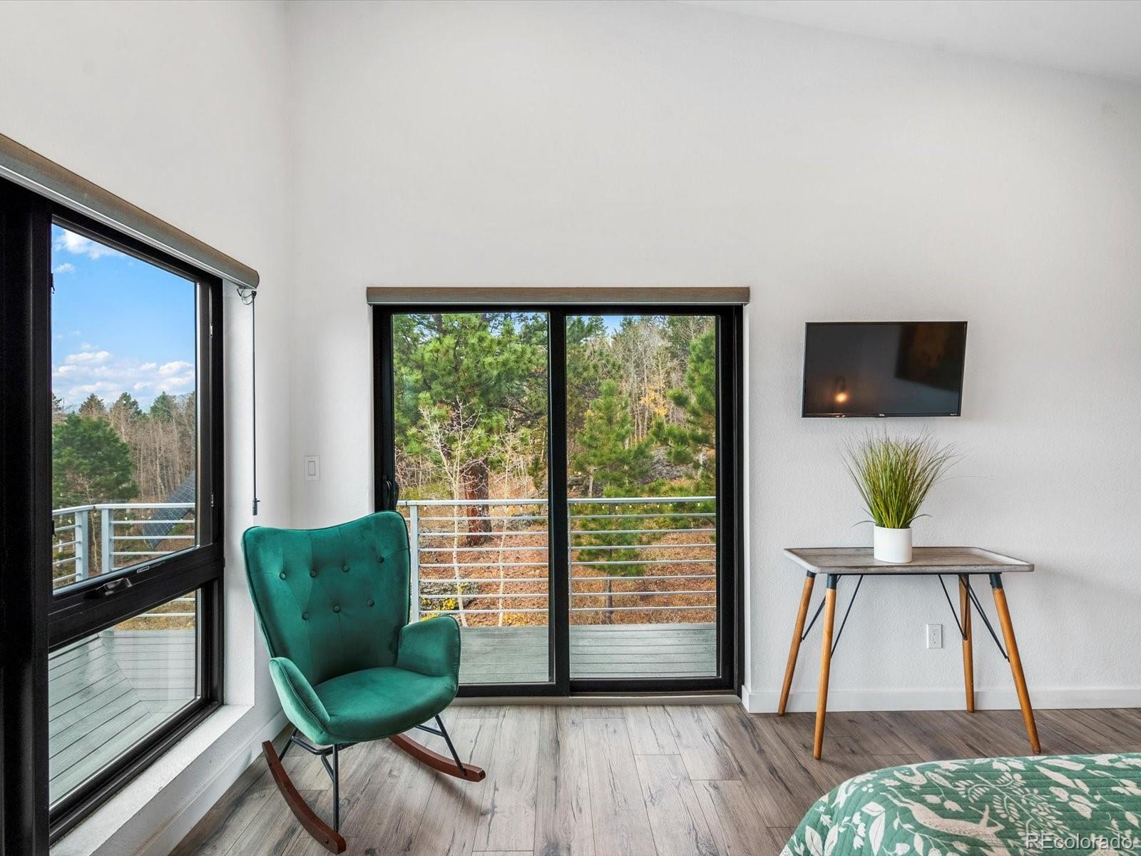 1044 Alps Hill Road Central City, CO 80427 - Photo 17 of 49 a living room with furniture and a large window