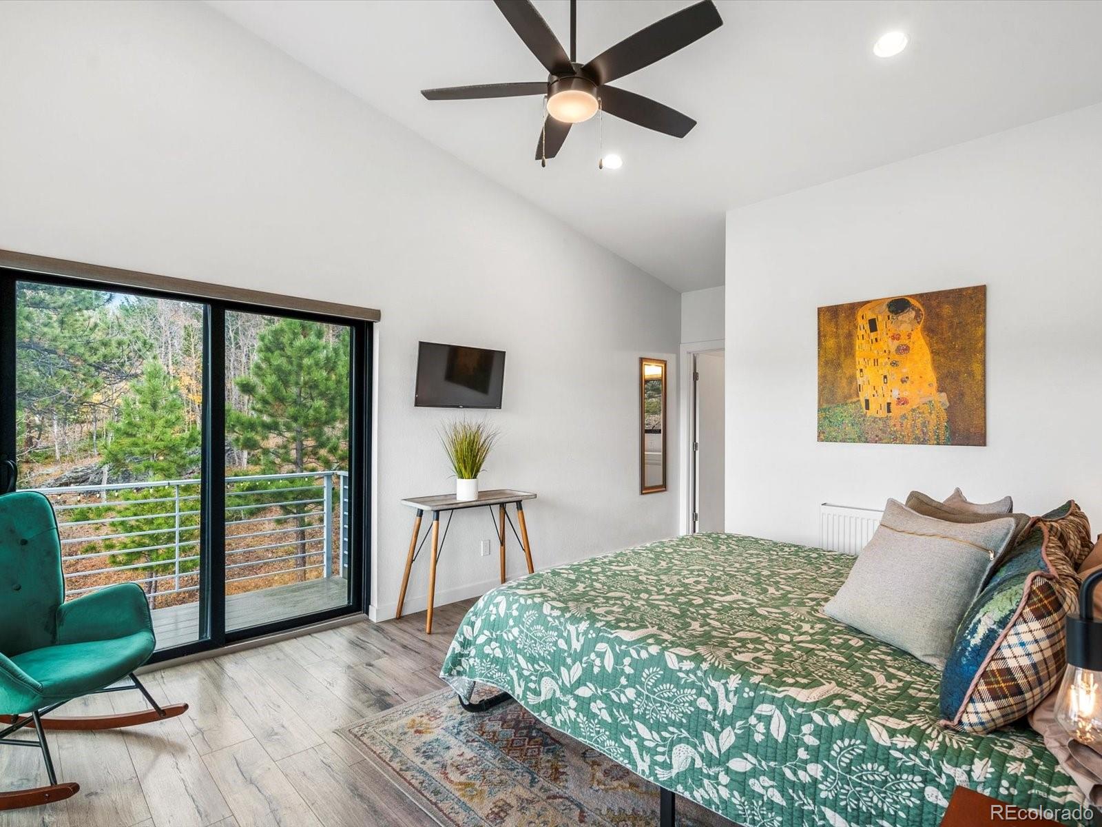 1044 Alps Hill Road Central City, CO 80427 - Photo 19 of 49 a bedroom with a bed and a large window