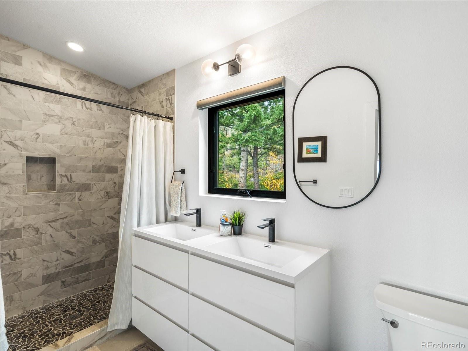 1044 Alps Hill Road Central City, CO 80427 - Photo 21 of 49 a bathroom with a sink and a mirror