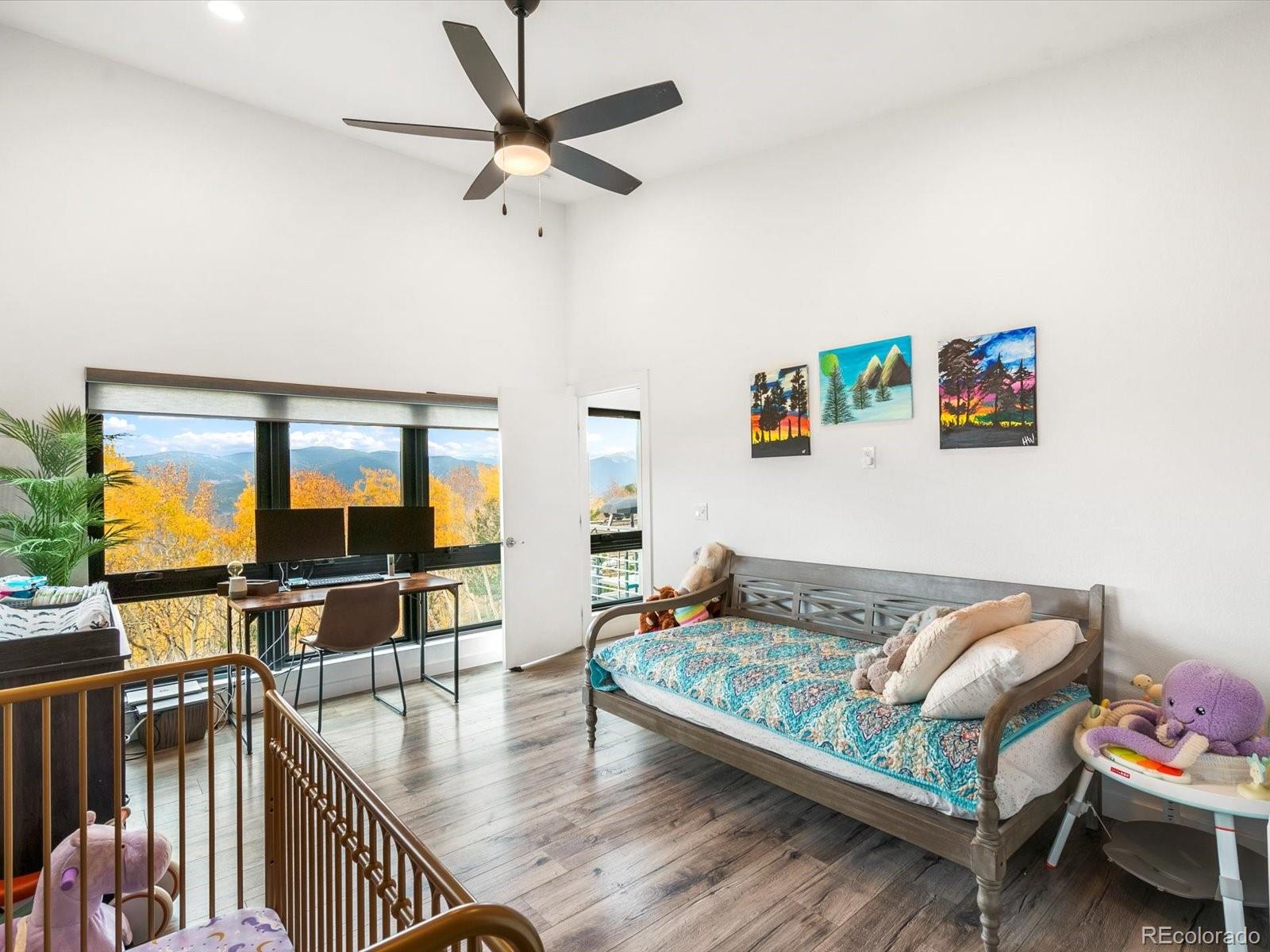 1044 Alps Hill Road Central City, CO 80427 - Photo 23 of 49 a living room with furniture and wooden floor