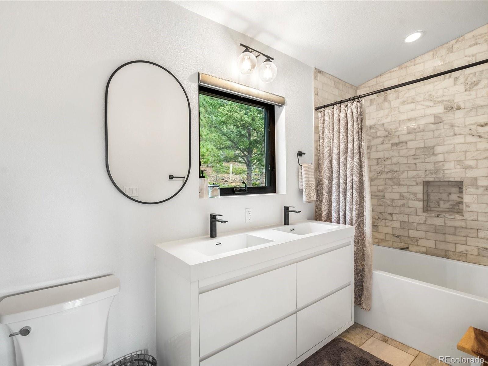 1044 Alps Hill Road Central City, CO 80427 - Photo 25 of 49 a bathroom with a sink and a mirror