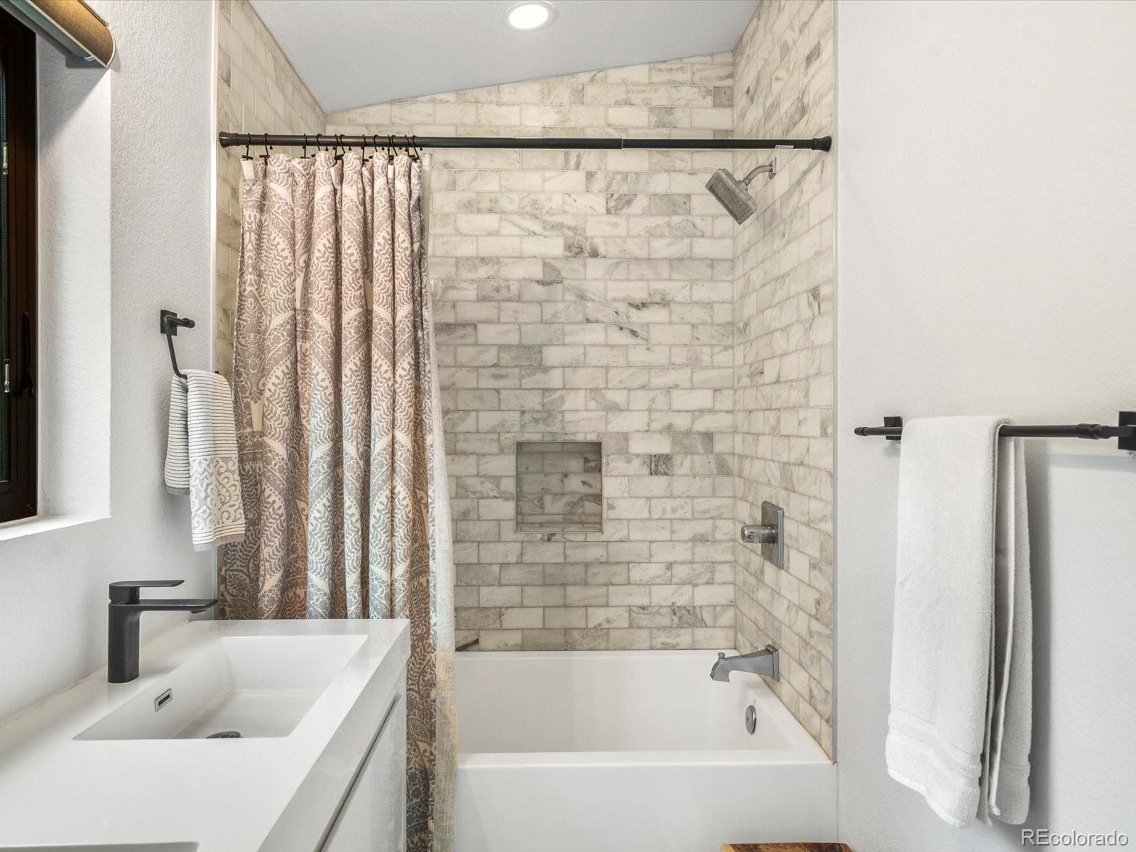 1044 Alps Hill Road Central City, CO 80427 - Photo 26 of 49 a bathroom with a sink and a bathtub