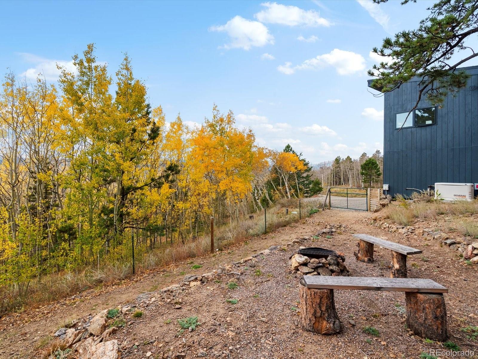 1044 Alps Hill Road Central City, CO 80427 - Photo 35 of 49 a view of a backyard with sitting area