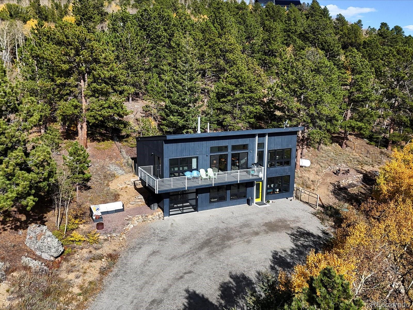 1044 Alps Hill Road Central City, CO 80427 - Photo 40 of 49 a view of house with a yard and sitting area
