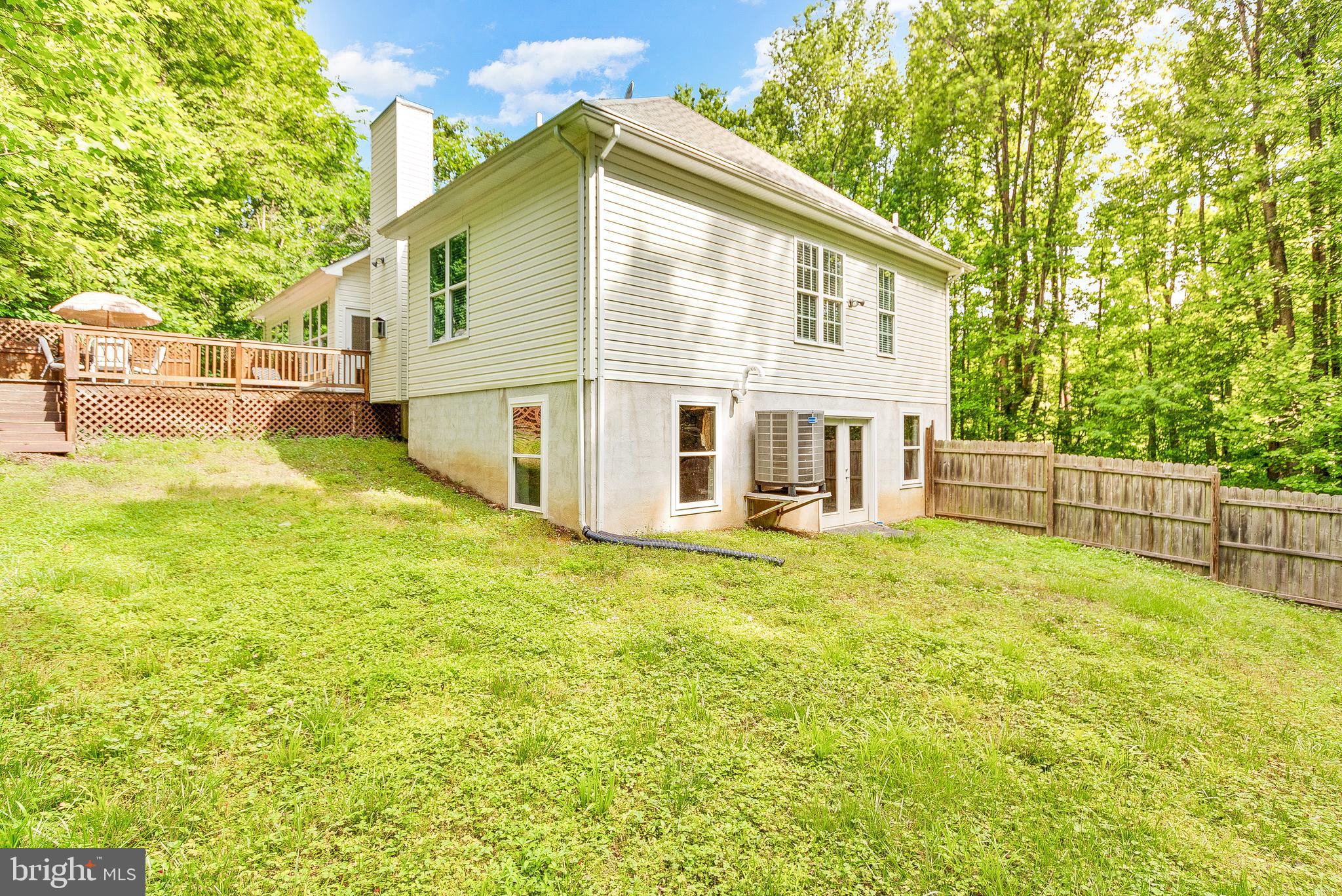1808 Wilson Road Huntingtown, MD 20639 - Photo 43 of 53 a view of a house with backyard and a tree