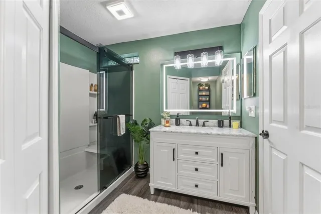 a bathroom with a double vanity sink and mirror