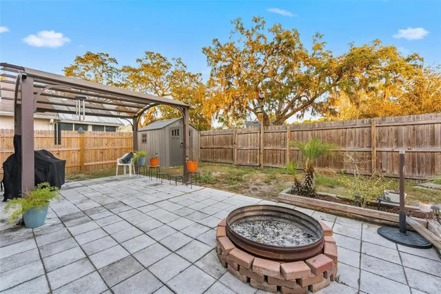 a view of a backyard with a iron fence