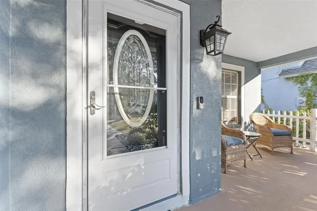 a view of a livingroom with furniture and front door