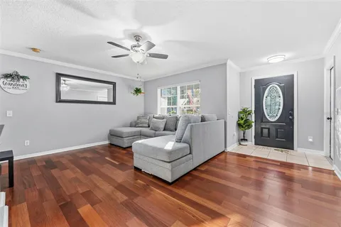 a living room with furniture and a window