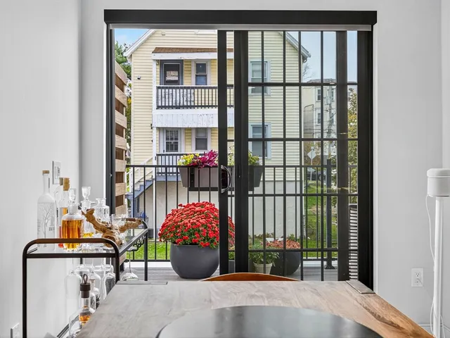 a view of a balcony with a potted plant