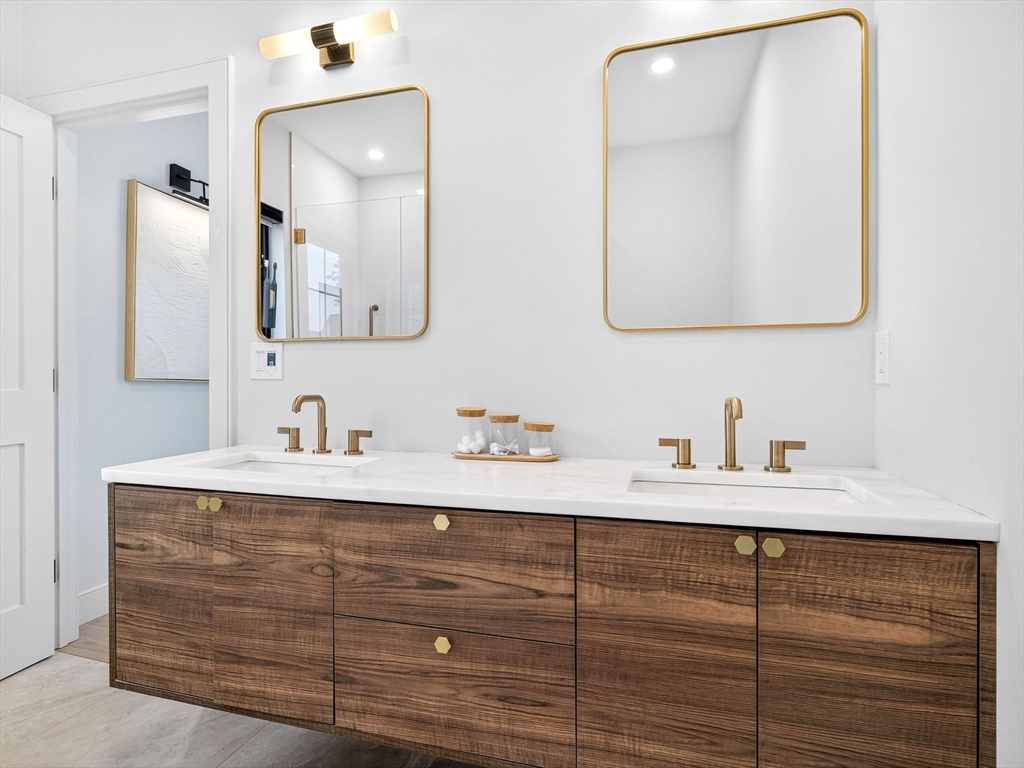 4 Payne Street, Unit FIVE Boston, MA 02122 - Photo 31 of 38 a bathroom with a sink vanity and mirror
