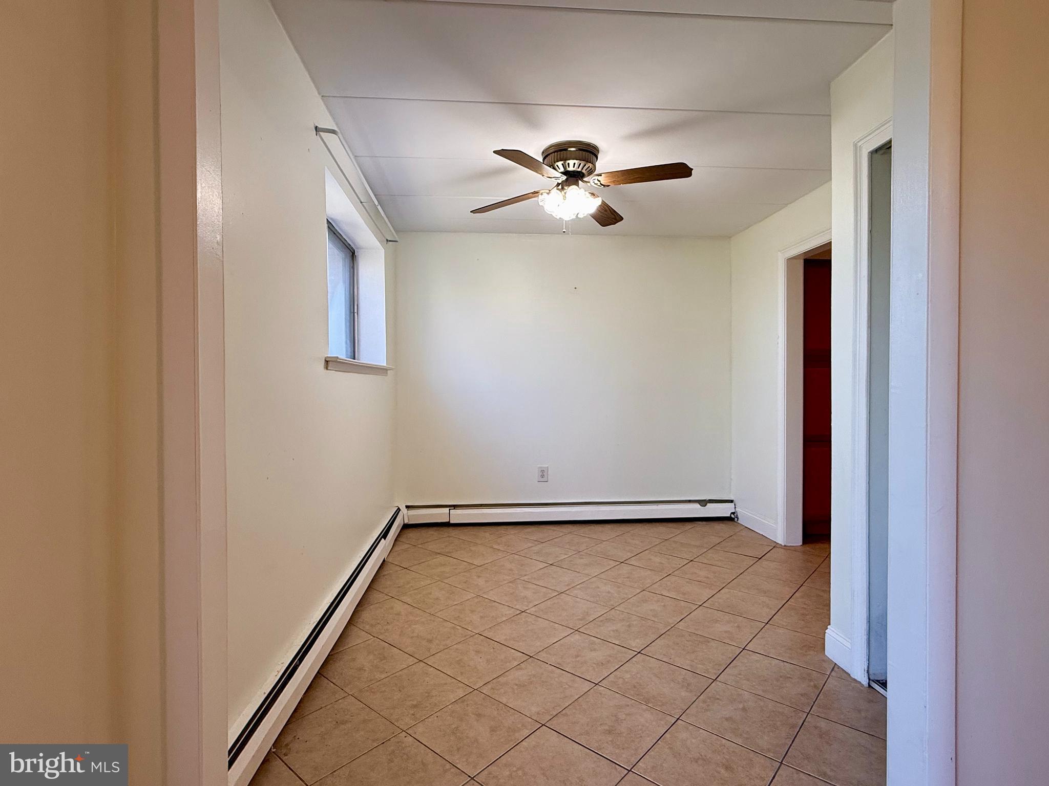1575 West Street Road, Unit 327 Warminster, PA 18974 - Photo 11 of 17 a view of a hallway with a chandelier
