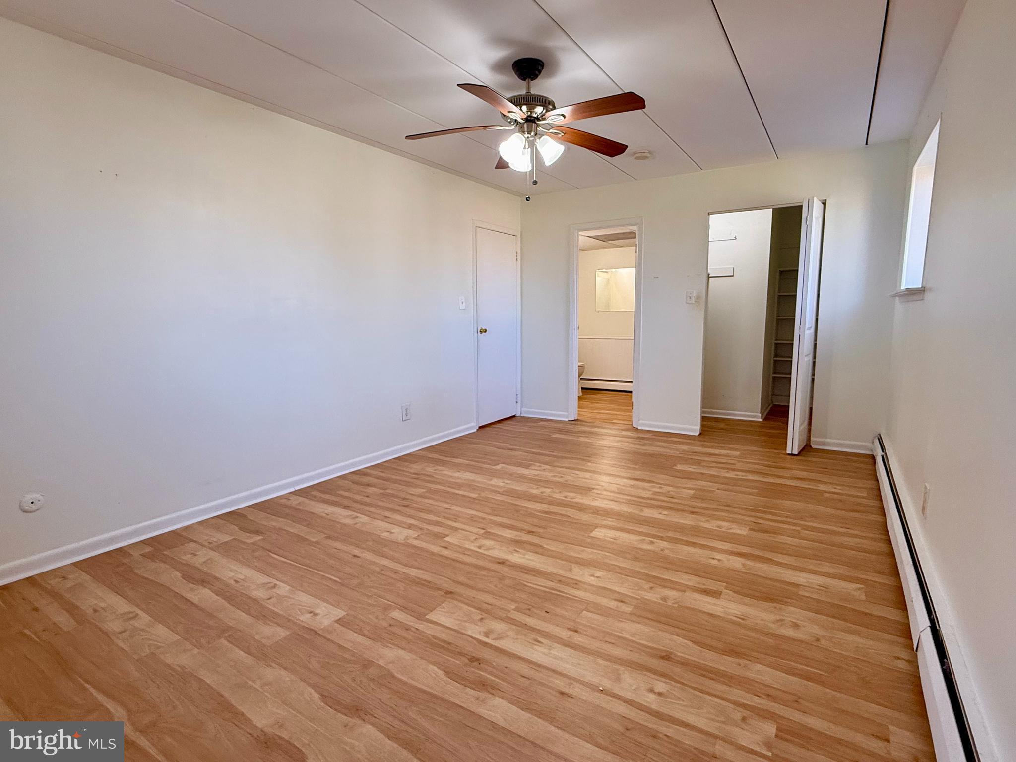 1575 West Street Road, Unit 327 Warminster, PA 18974 - Photo 12 of 17 a view of an empty room with a ceiling fan
