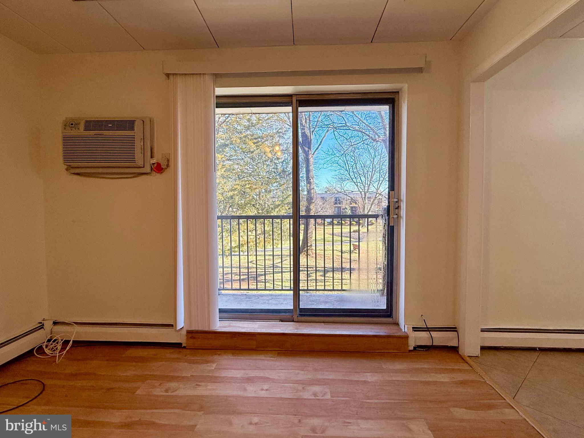 1575 West Street Road, Unit 327 Warminster, PA 18974 - Photo 15 of 17 a view of empty room with wooden floor and fan
