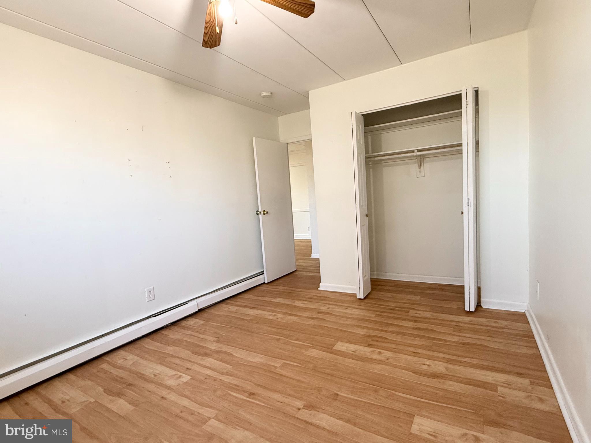 1575 West Street Road, Unit 327 Warminster, PA 18974 - Photo 16 of 17 a view of an empty room with wooden floor