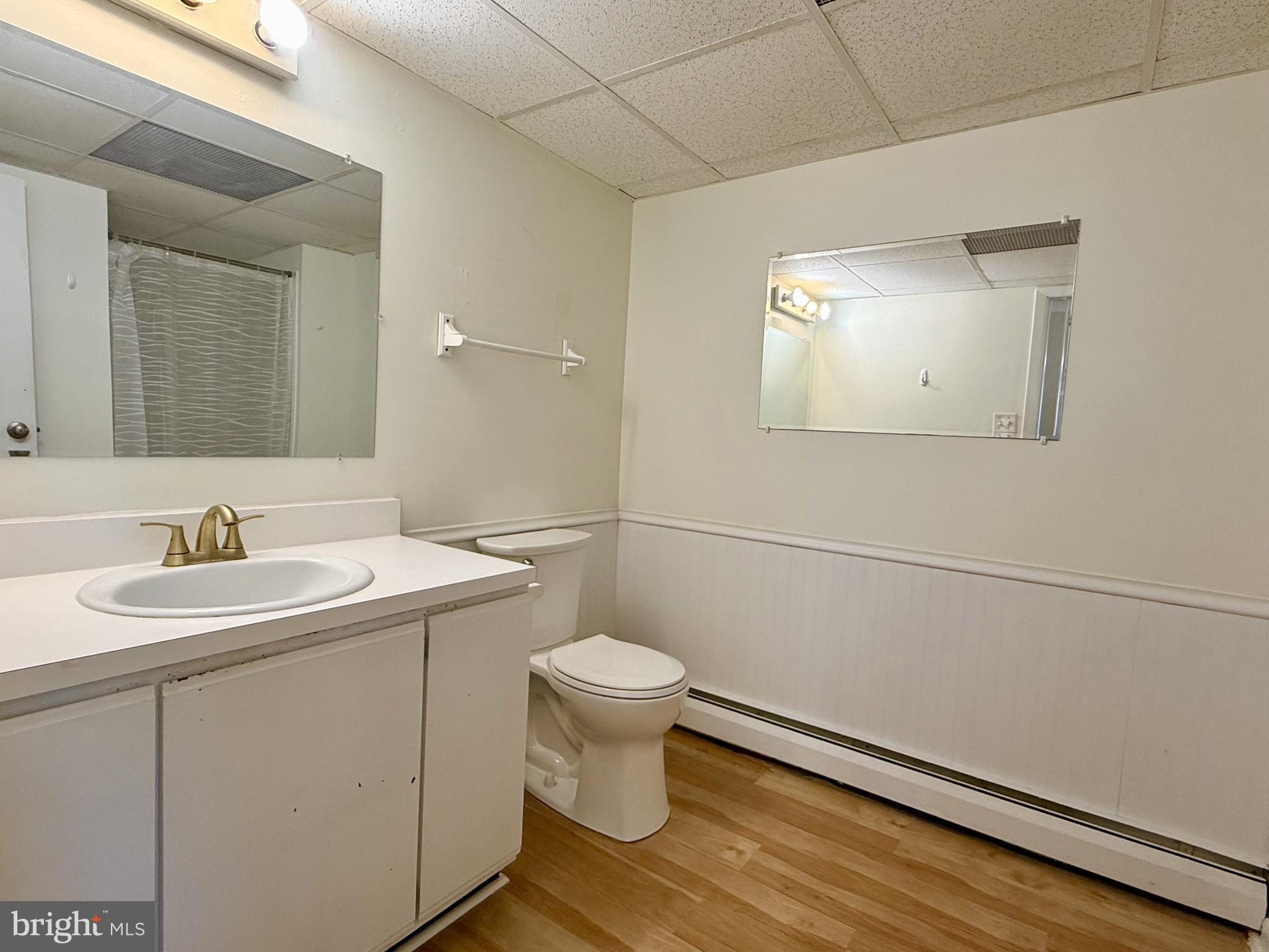 1575 West Street Road, Unit 327 Warminster, PA 18974 - Photo 4 of 17 a bathroom with a sink toilet and a mirror