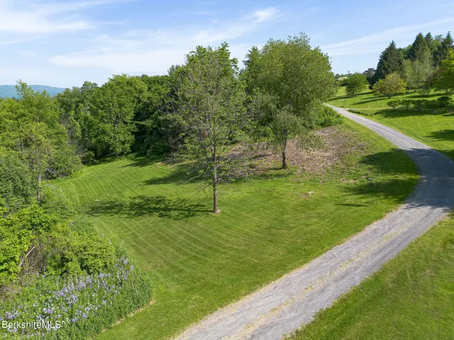 a view of a garden with a building