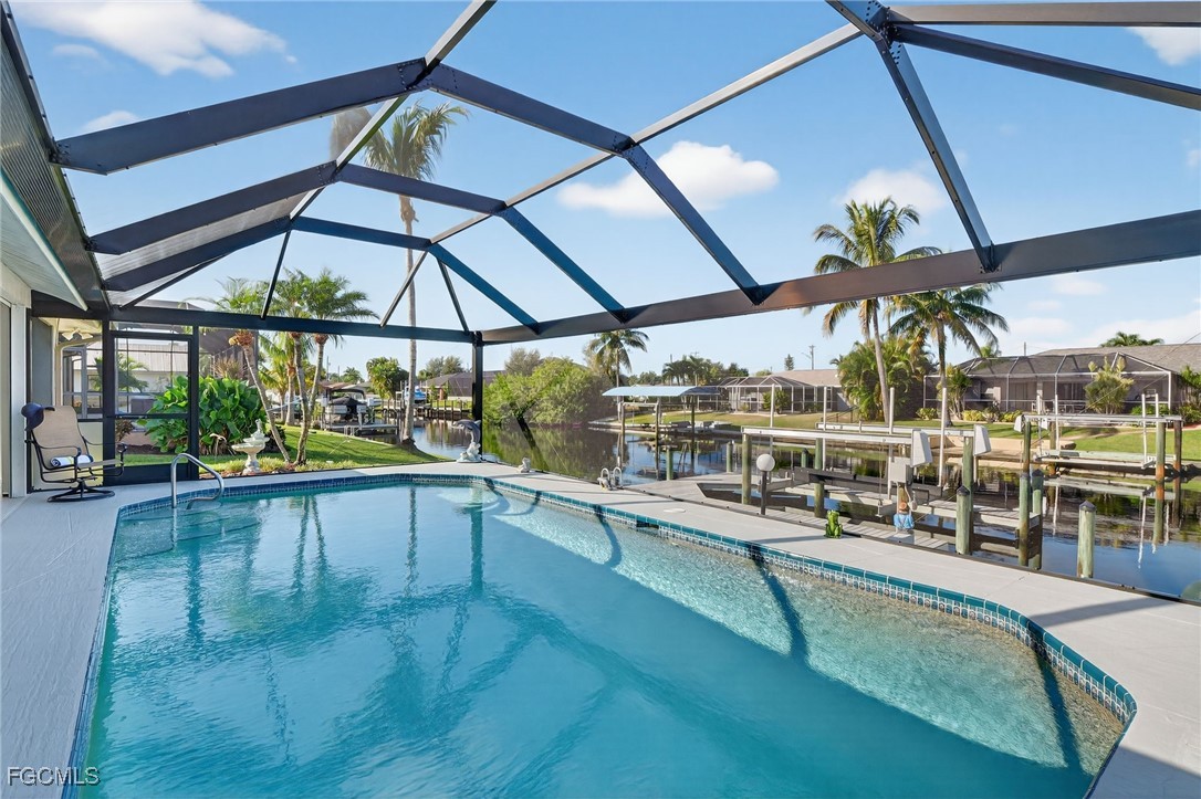 4306 Southwest 3rd Avenue Cape Coral, FL 33914 - Photo 32 of 50 a view of a swimming pool with a porch