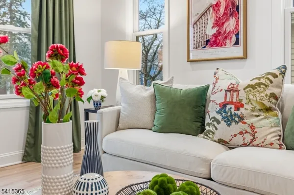 a living room with furniture and a rug