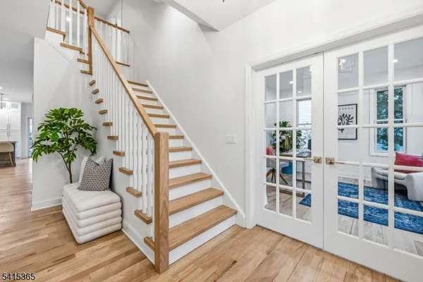 a spacious bedroom with a bed a table and chair