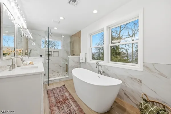 a utility room with sink dryer and washer
