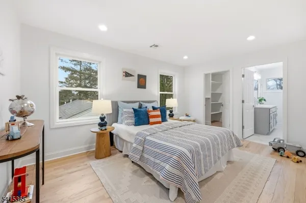 a bedroom with furniture and a bed