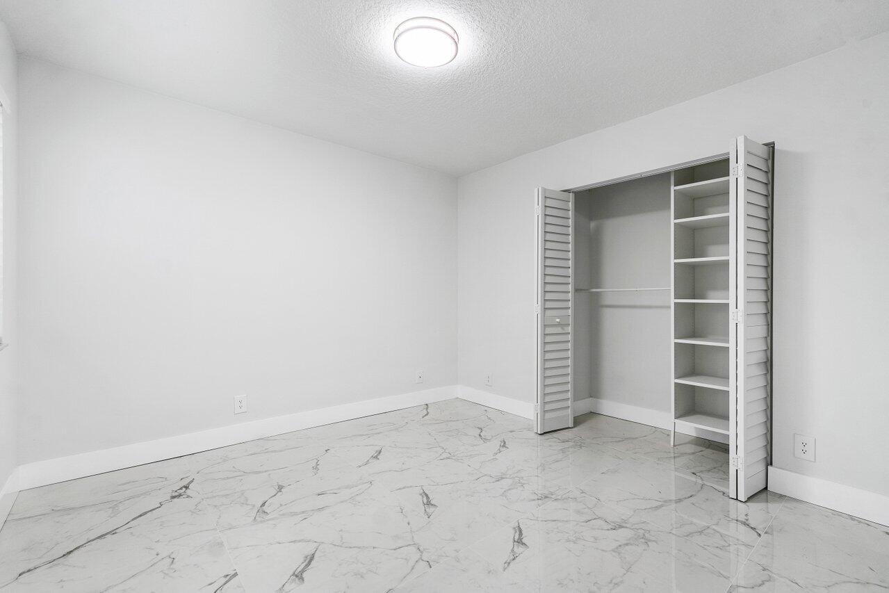 7809 Travelers Tree Drive Boca Raton, FL 33433 - Photo 14 of 33 an empty room with a empty space
