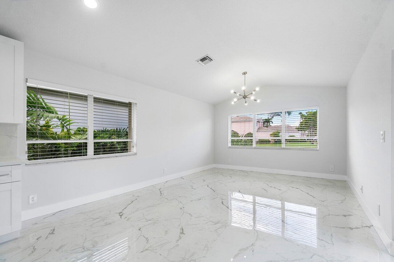 7809 Travelers Tree Drive Boca Raton, FL 33433 - Photo 24 of 33 a view of an empty room with a window
