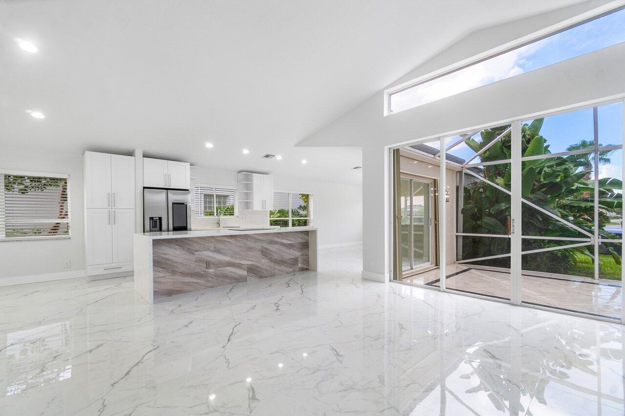 7809 Travelers Tree Drive Boca Raton, FL 33433 - Photo 29 of 33 a view of kitchen with furniture and refrigerator