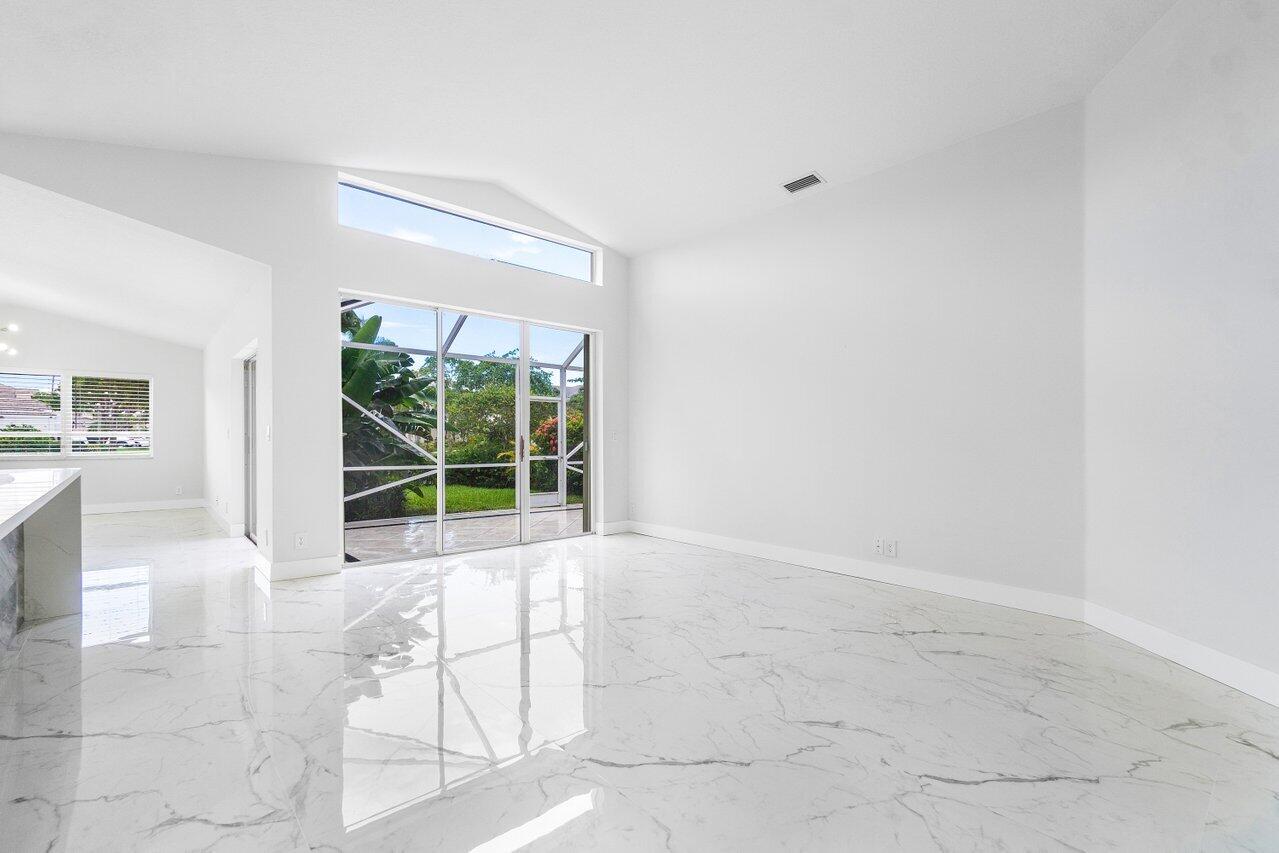 7809 Travelers Tree Drive Boca Raton, FL 33433 - Photo 30 of 33 a view of an empty room with a window