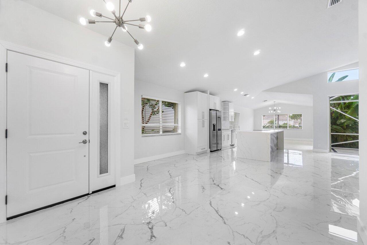 7809 Travelers Tree Drive Boca Raton, FL 33433 - Photo 33 of 33 a view of a kitchen with a sink and cabinet area