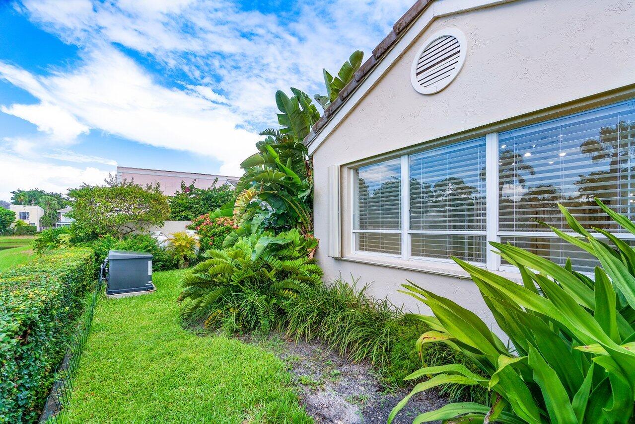 7809 Travelers Tree Drive Boca Raton, FL 33433 - Photo 5 of 33 a view of house with backyard space and garden