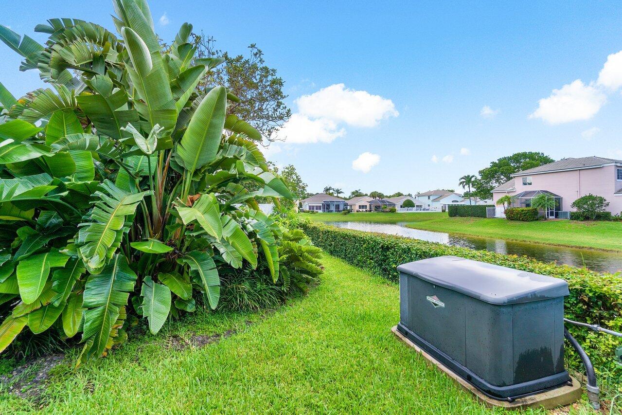 7809 Travelers Tree Drive Boca Raton, FL 33433 - Photo 8 of 33 a view of a garden and swimming pool
