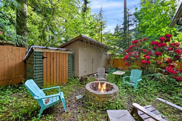 a view of house with backyard space and garden