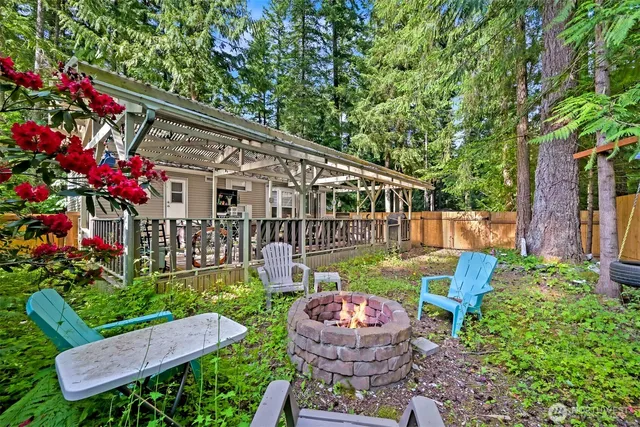 a front view of a house with a yard table and chairs
