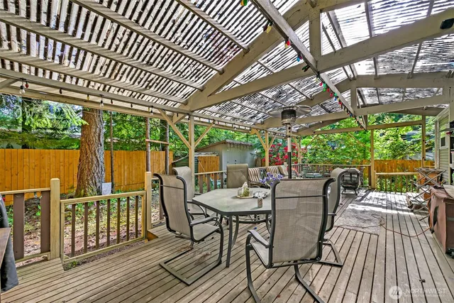 a view of a chairs and table in the deck