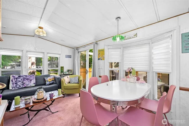 a living room with furniture and a table