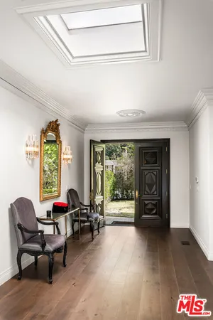 a view of workspace with mirror and window