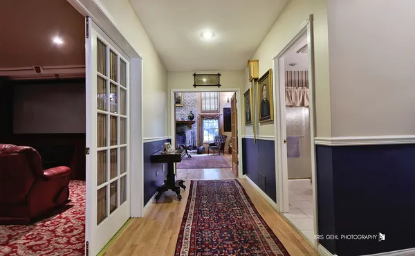 a living room with furniture a projector and flat screen