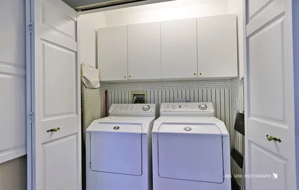 a bathroom with a sink a bathtub and a window