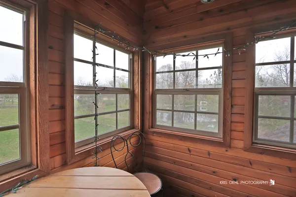a view of a lake with a yard and a fountain