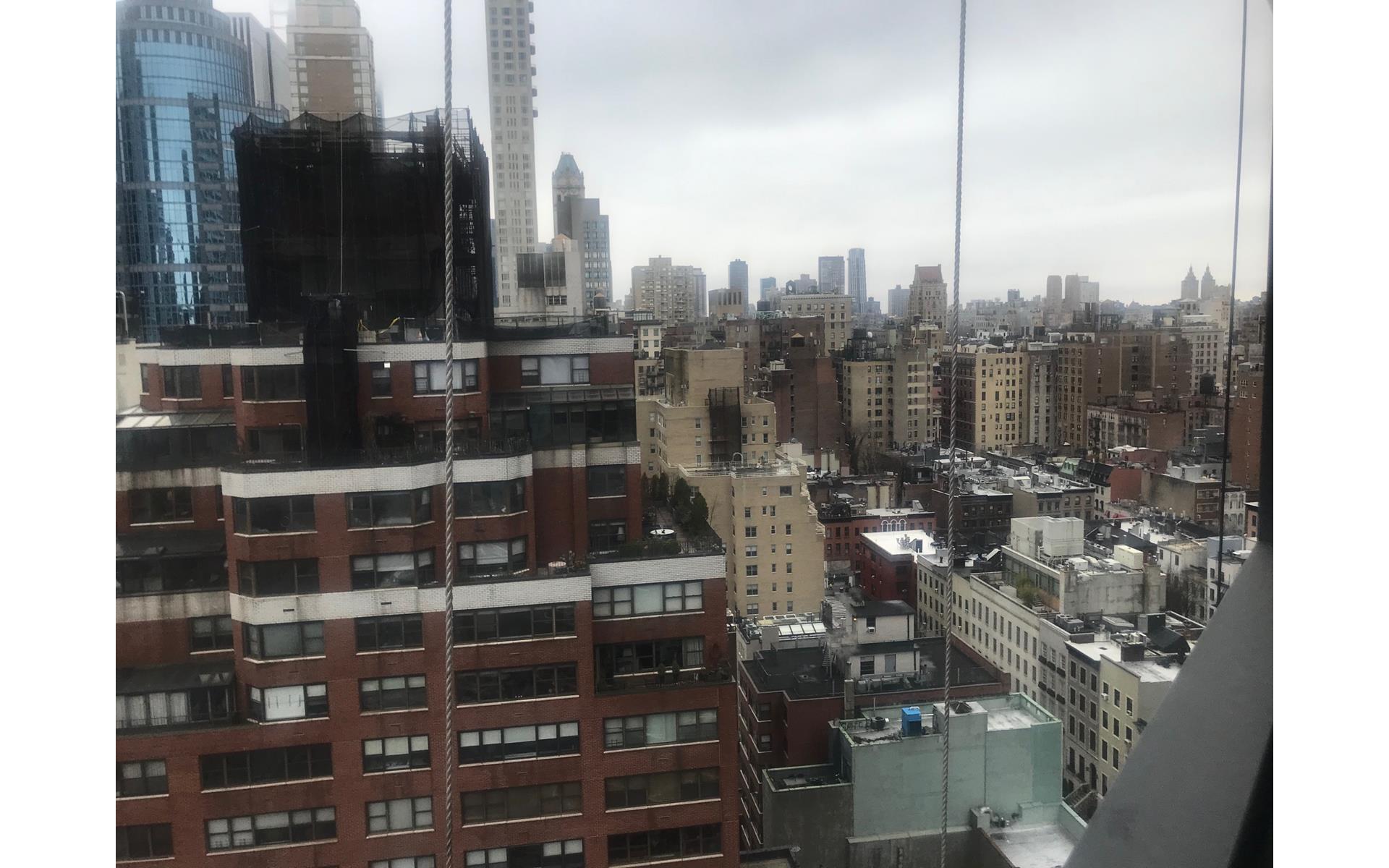 200 East 61st Street, Unit 20A Manhattan, NY 10065 - Photo 2 of 10 a view of tall buildings