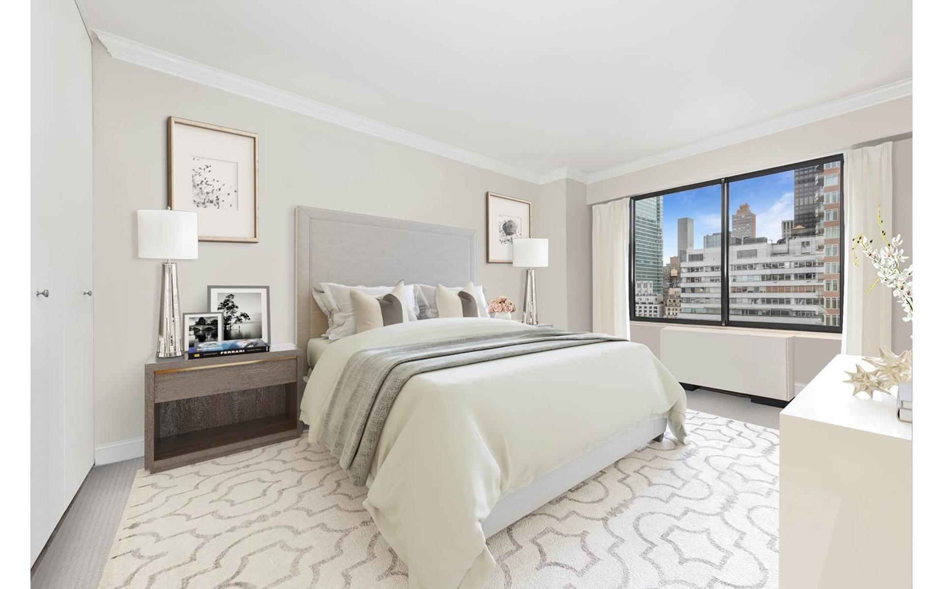 200 East 61st Street, Unit 20A Manhattan, NY 10065 - Photo 5 of 10 a bedroom with a large bed and a window
