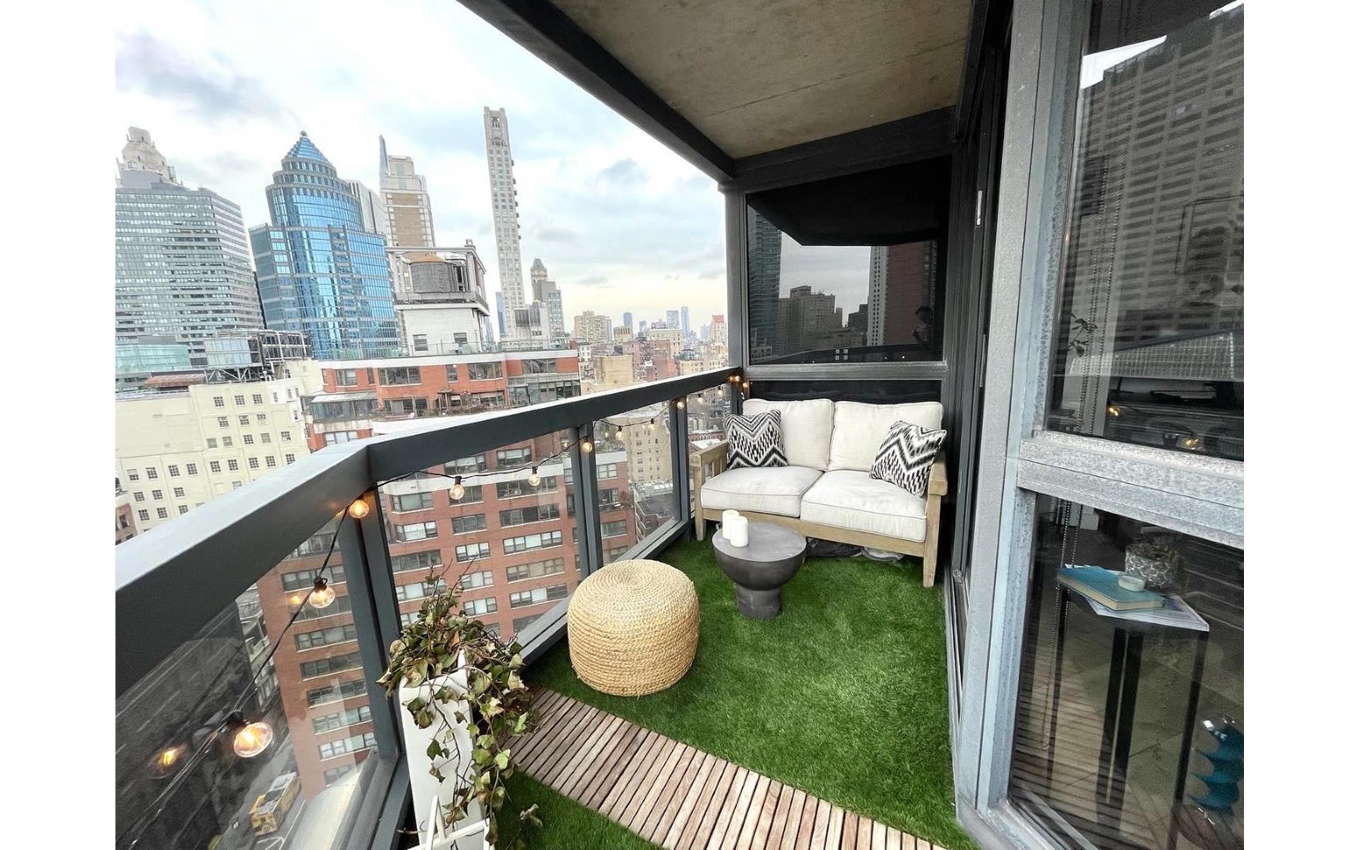 200 East 61st Street, Unit 20A Manhattan, NY 10065 - Photo 8 of 10 a view of city from a balcony