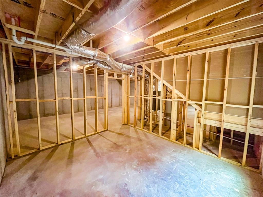 205 Perkins Road Dahlonega, GA 30533 - Photo 39 of 51 a view of an empty room with wooden floor and windows