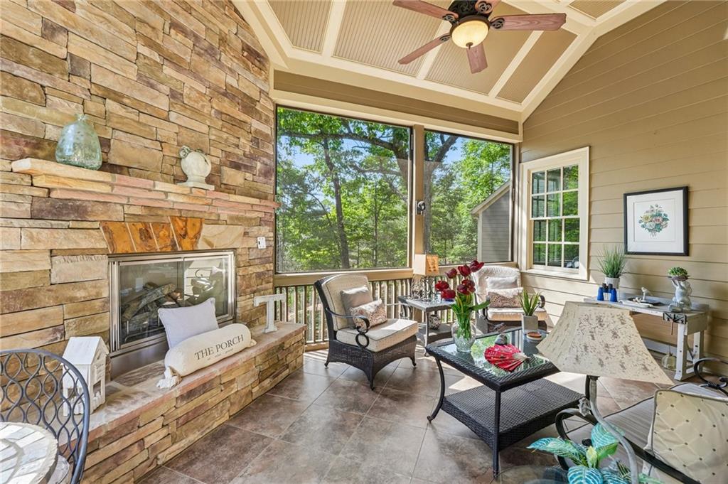 189 Red Trillium Ridge Big Canoe, GA 30143 - Photo 33 of 98 a living room with furniture and floor to ceiling windows