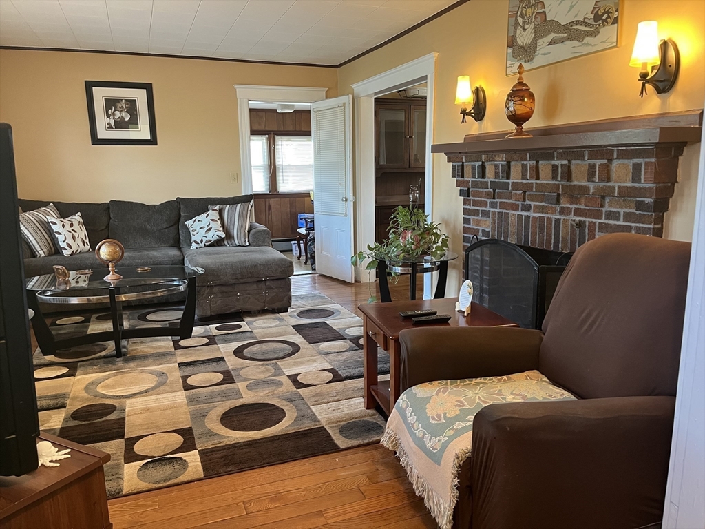 136 West Street Randolph, MA 02368 - Photo 3 of 13 a living room with furniture and a window