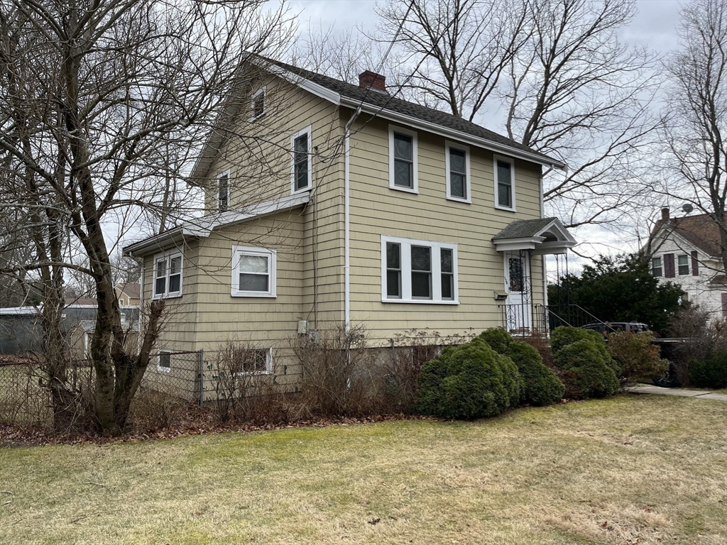 136 West Street Randolph, MA 02368 - Photo 5 of 13 a view of a house with a yard